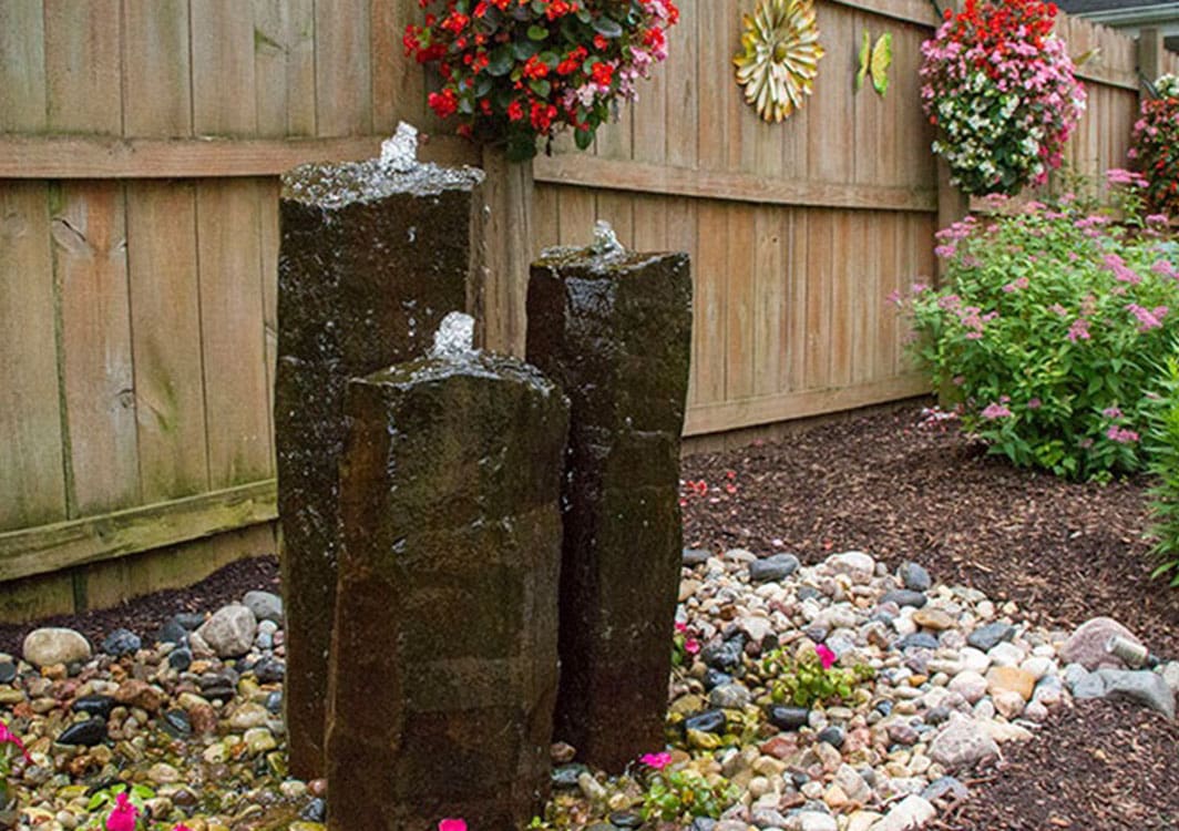Fountainscape beside a driveway entrance