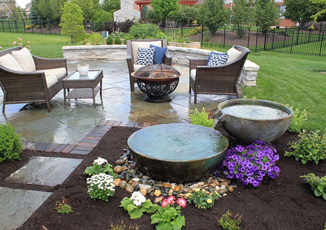 Decorative urn fountain on a stone patio