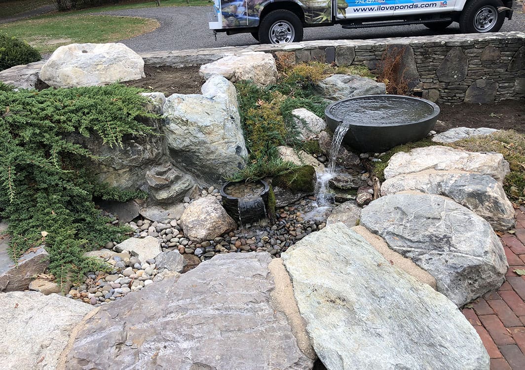 Fountainscape with underwater LED lighting at dusk