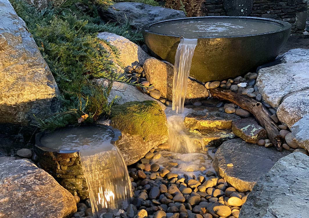 Sphere fountain bubbling in a front garden