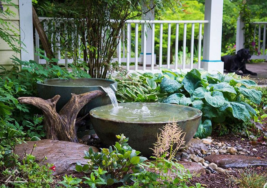 Fountainscape edging a stone walkway