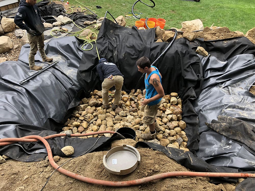 Pond under construction with the liner folded into the deep zone