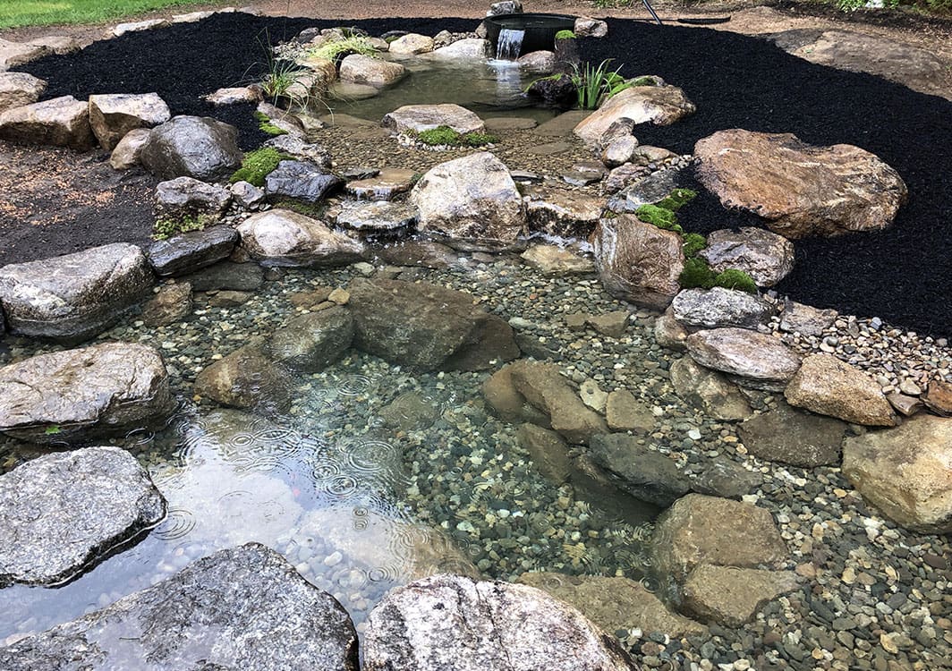 Stream and waterfall combination built into a hillside