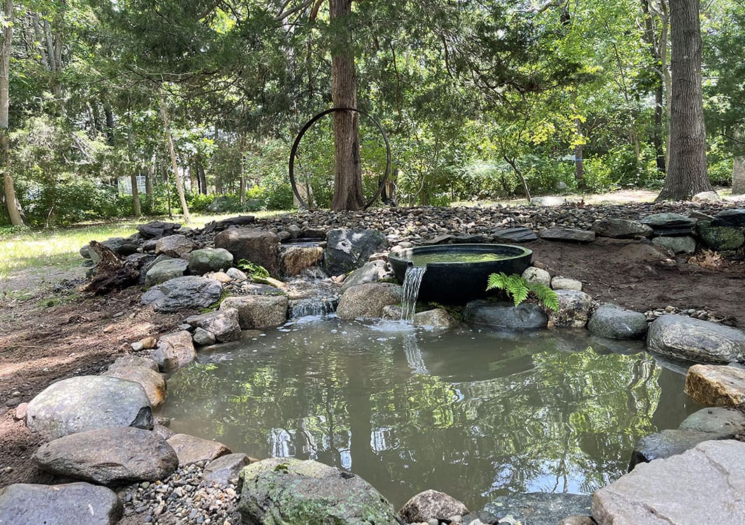 Stacked stone waterfall taking shape during construction