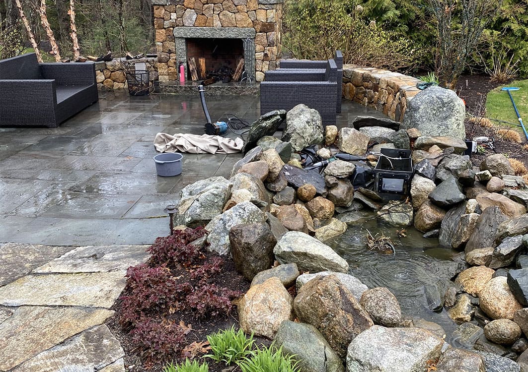 Pond renovation in progress with the old rock removed
