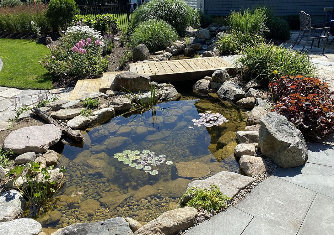 Edge repair underway on a leaking pond