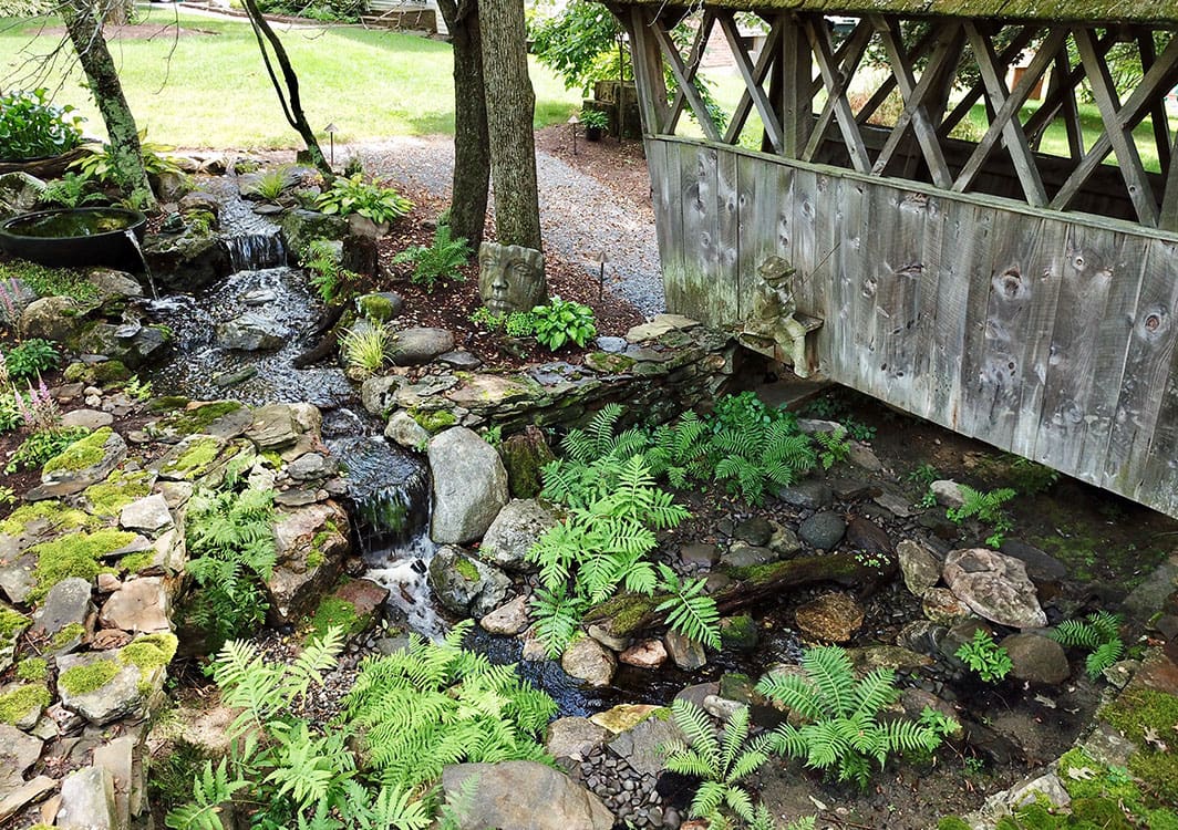 Pondless waterfall running alongside a walkway