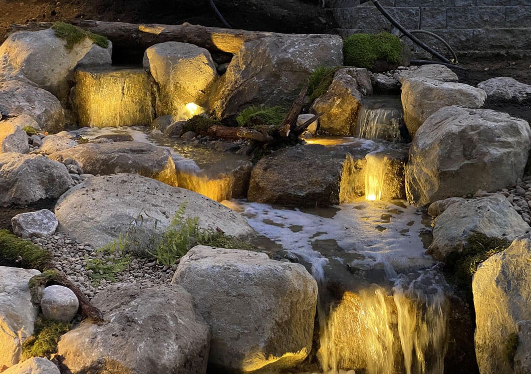 Pondless waterfall with layered stone terraces