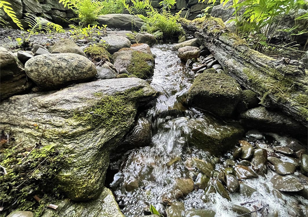 Pondless waterfall under construction with the basin exposed