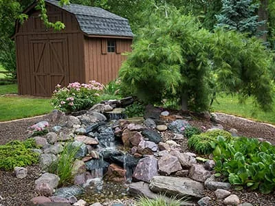 Small pondless waterfall, 5 ft length, built by New England Aquatic Landscaping